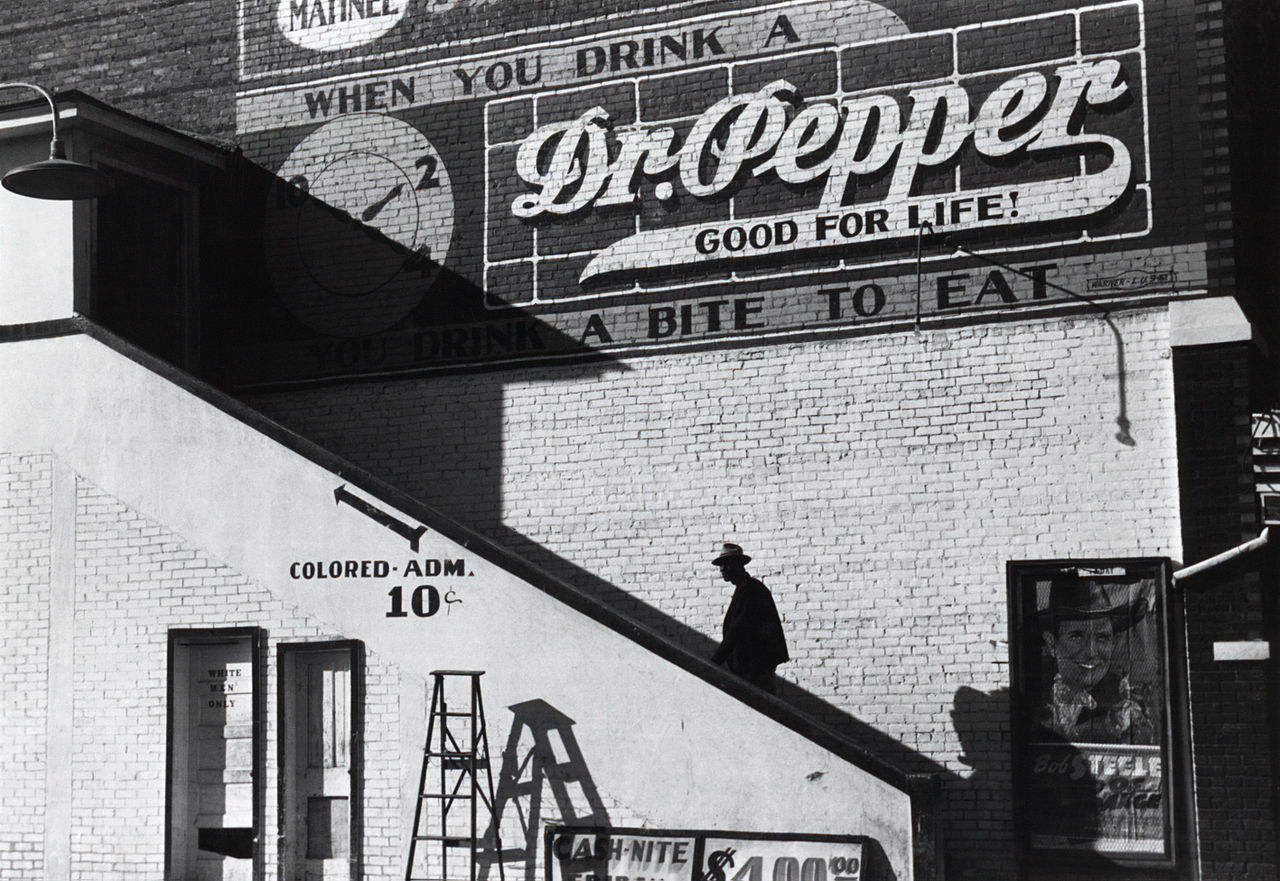 An African American patron going in the “colored” entrance of the Crescent Theatre in Belzoni, Mississippi on a Saturday afternoon in 1939. (Library of Congress/Wikipedia)