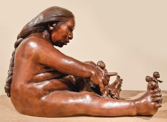 Roxanne Swentzell - “Storyteller/That Way," bronze, 2014. Photo by Phillip Karshis/K photo.