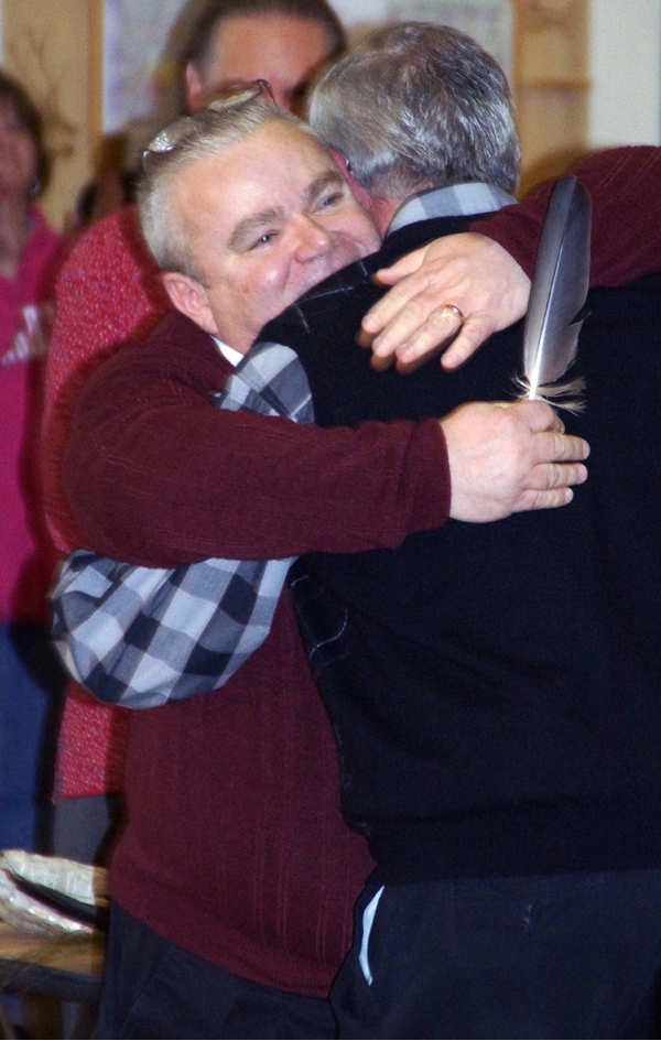 Tim LaCroix and Gene Barfield embrace in a hug following the official announcement of their marriage. (Courtesy Annette VanDeCar, LTBB Communications Coordinator)