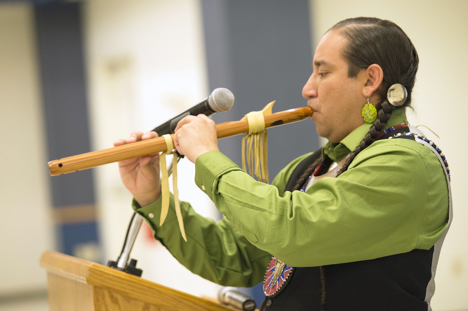 university-of-north-dakota-rain-flute Allen Demaray plays the flute during an American Indian blessing ritual as part of a recent 25th anniversary celebration for UND’s Recruitment/Retention of American Indians into Nursing program. (Courtesy Jackie Lorentz)