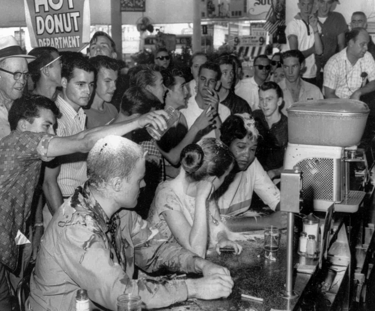 A scene from the May 28, 1963 sit-in at a Woolworth’s lunch counter in Jackson, Mississippi. Seated at the counter, from left, are Native American Professor John Salter or “Hunter Bear,” Joan Trumpauer and Anne Moody, who died February 5 at 74. (Fred Blackwell/AP Images/Jackson Daily News)